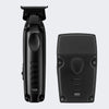 Black cordless hair trimmer shown from the front and back against a light gray background.