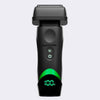 BaBylissPRO electric shaver shown from the front on a light gray background. The shaver is primarily black with a bright green illuminated digital display at the bottom showing '100%' and a green curved accent line on the front.