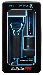 Babyliss Pro Bluefx FX-ONE one-battery system kit in its original black packaging box, featuring a black electric shaver with blue LED lighting accents and a blue charging/cleaning tool.