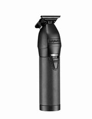 A black Babyliss cordless hair clipper with a textured grip and metallic cutting head, shown vertically against a plain white background.
