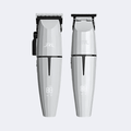 Two silver hair trimmers with digital display on a white background