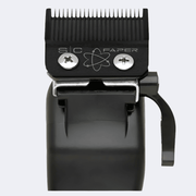 Black hair trimmer head with visible branding on a white background